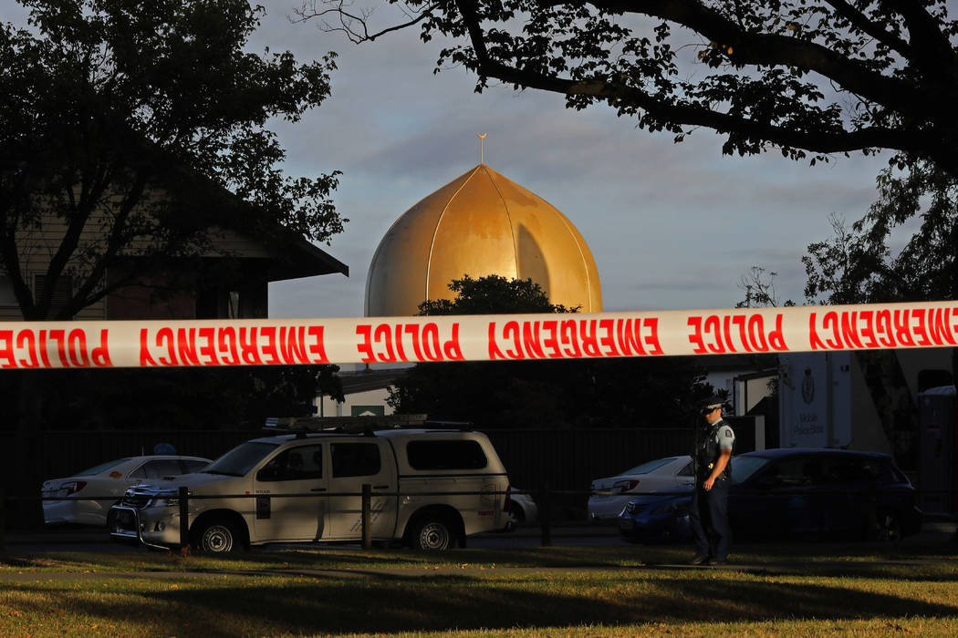 A police officer stands guard in front of the Masjid Al Noor mosque in Christchurch, New Zealan ...