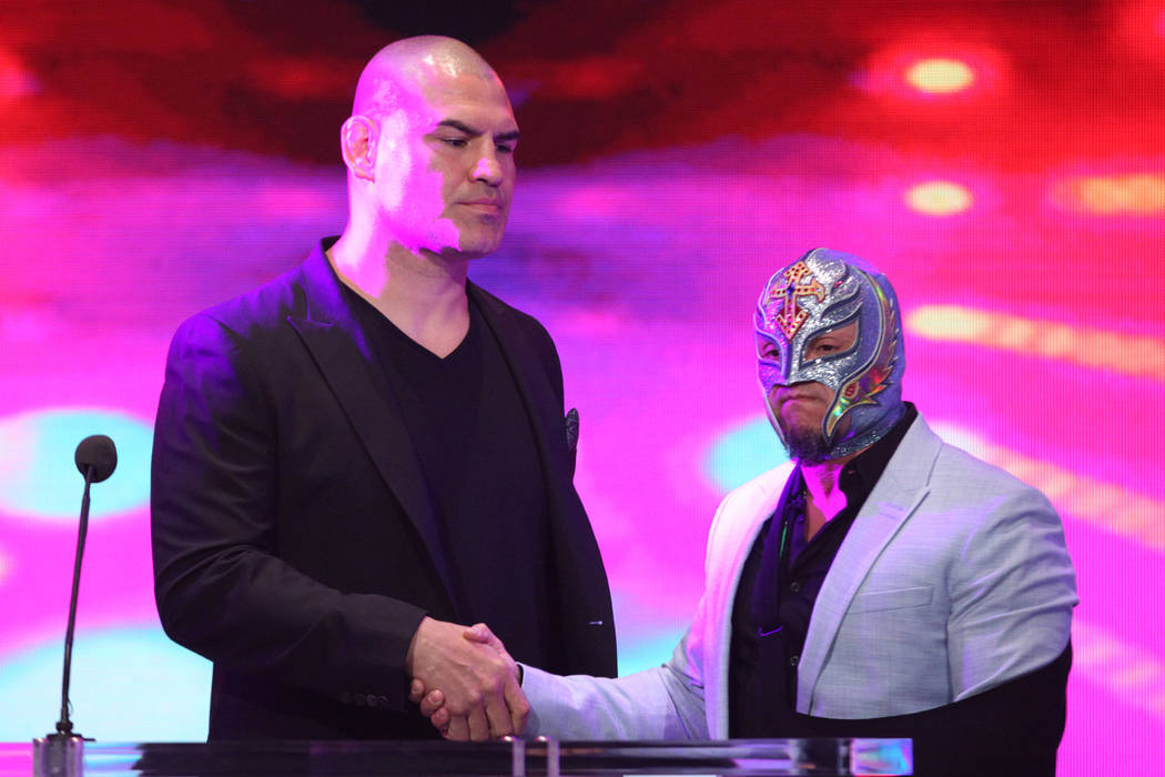 Cain Velasquez, left, and Rey Mysterio, during a World Wrestling Entertainment press conference ...