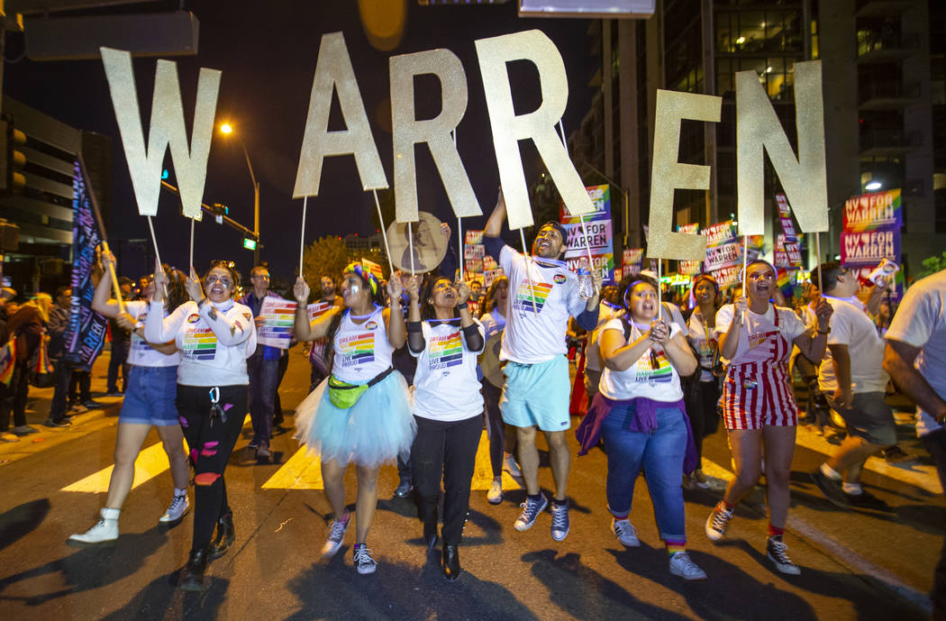 Supporters of Democratic presidential candidate Sen. Elizabeth Warren, D-Mass., marching in the ...