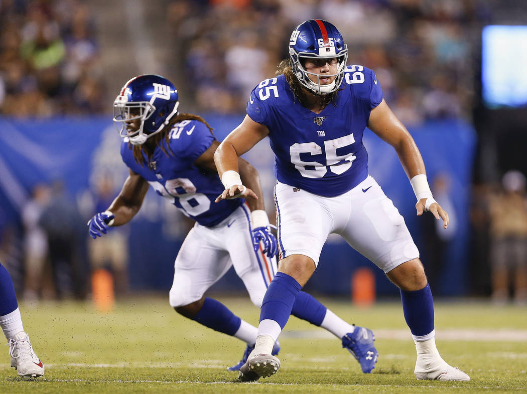 New York Giants offensive guard Nick Gates (65) looks to block during the second quarter of a p ...