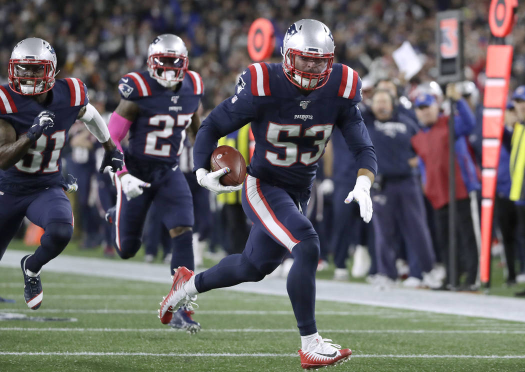 New England Patriots linebacker Kyle Van Noy runs for a touchdown after recovering a New York G ...