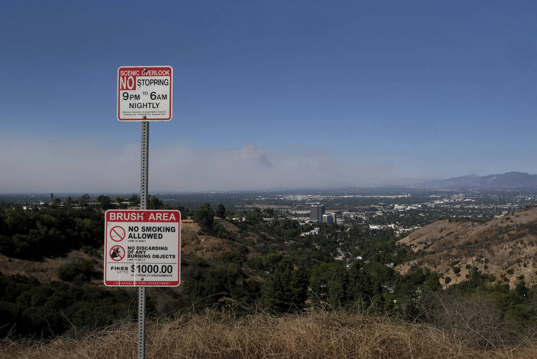 Smoke from the Saddleridge fire, in Porter Ranch, can be seen from an overlook on Mulholland Hi ...