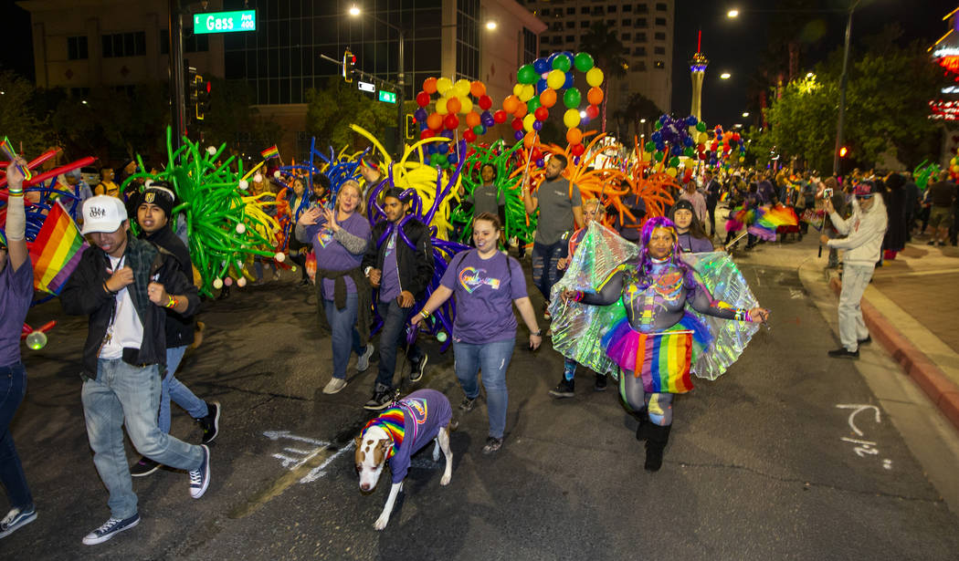 Participants move up S. Fourth Street during the annual Las Vegas Pride Night Parade on Friday, ...