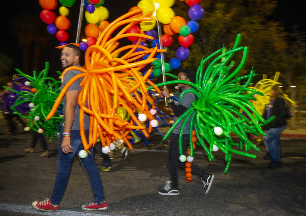 Participants in balloon costumes move up S. Fourth Street during the annual Las Vegas Pride Nig ...