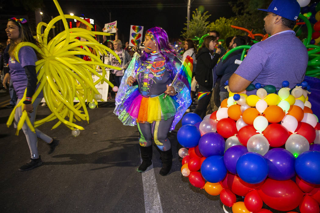 Participants in costumes march up S. Fourth Street during the annual Las Vegas Pride Night Para ...
