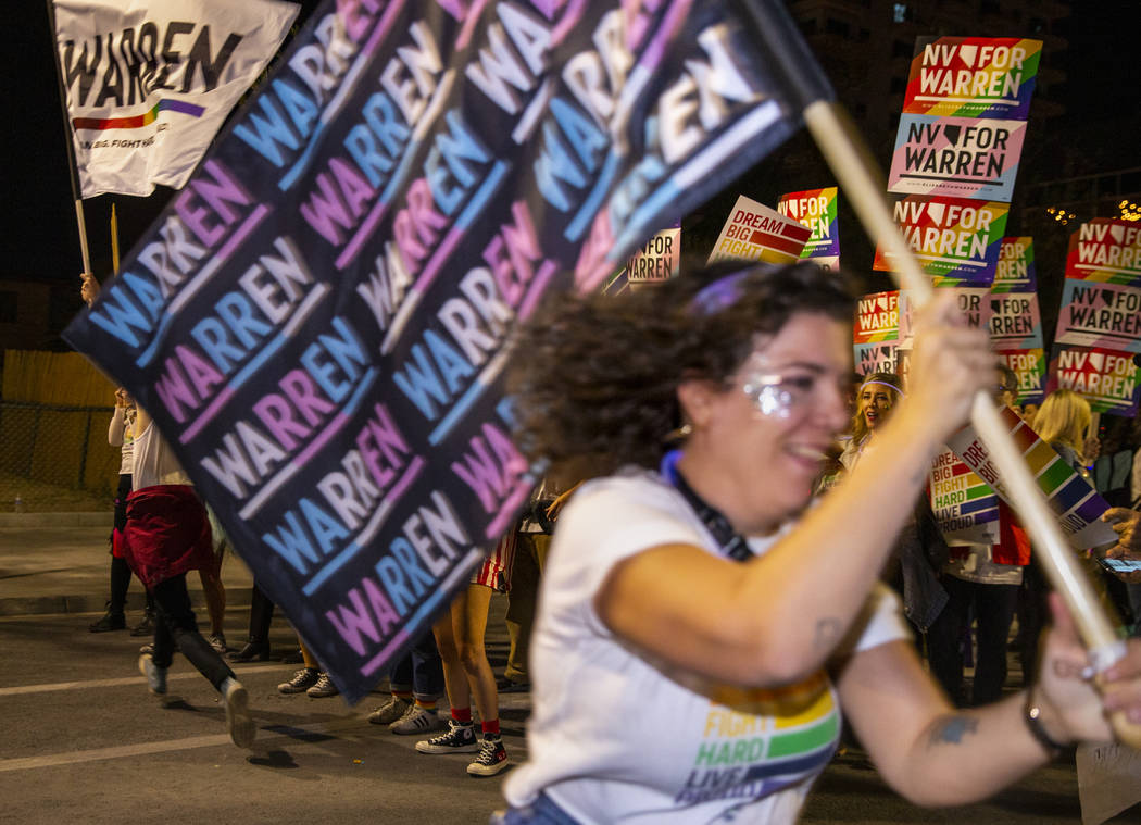 Supporters of Democratic presidential candidate Sen. Elizabeth Warren, D-Mass., celebrate durin ...