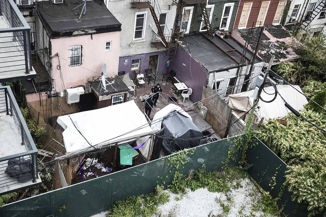 NYPD investigates the scene of a shooting in the Brooklyn borough of New York on Saturday, Oct. ...