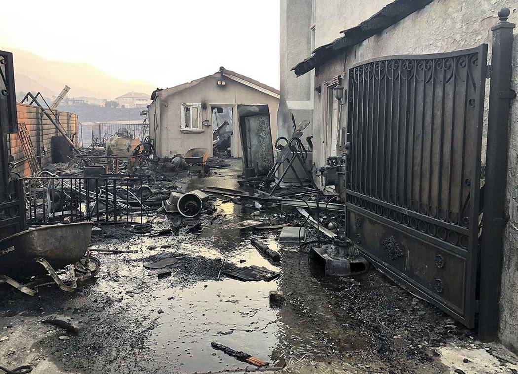 Santa Ana wind driven flames destroyed this home on Beaufait Ave. in Porter Ranch, Calif,. on F ...