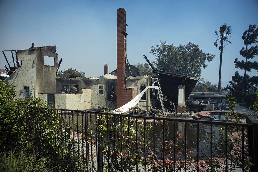 The Manokian home on Hampton Court in the Porter Ranch area of Los Angeles is seen after it bur ...