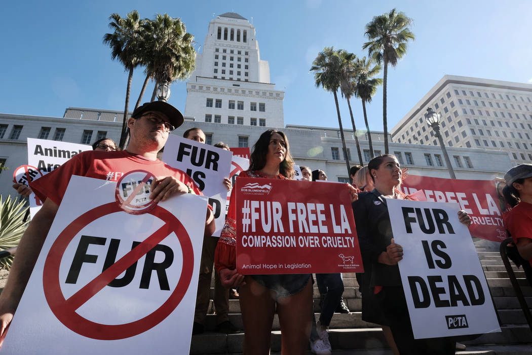 FILE -- In this Sept. 18, 2018 file photo protesters with the People for the Ethical Treatment ...