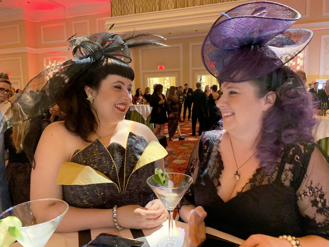 Sisters Megan Harvey and Nikki Harvey of Canada mingle during cocktail hour at The Neon Museum' ...