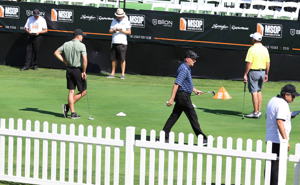 Players compete during the Major Series of Putting at Legacy Golf Club on Monday, Oct. 14, 2019 ...