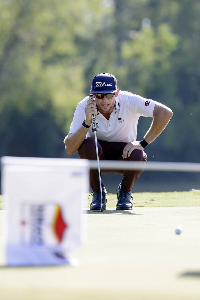 Lanto Griffin lines up his putt on the eighth green during the fourth round of the Houston Open ...