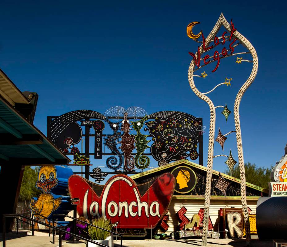 Art pieces "Neon Grid Wall" at left with "Lost Vegas Sign Tower" by Tim Bur ...