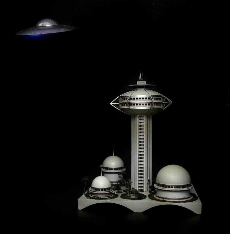 Art pieces "Space Saucer With Dents" at left and "Model for the LandMark Hotel a ...