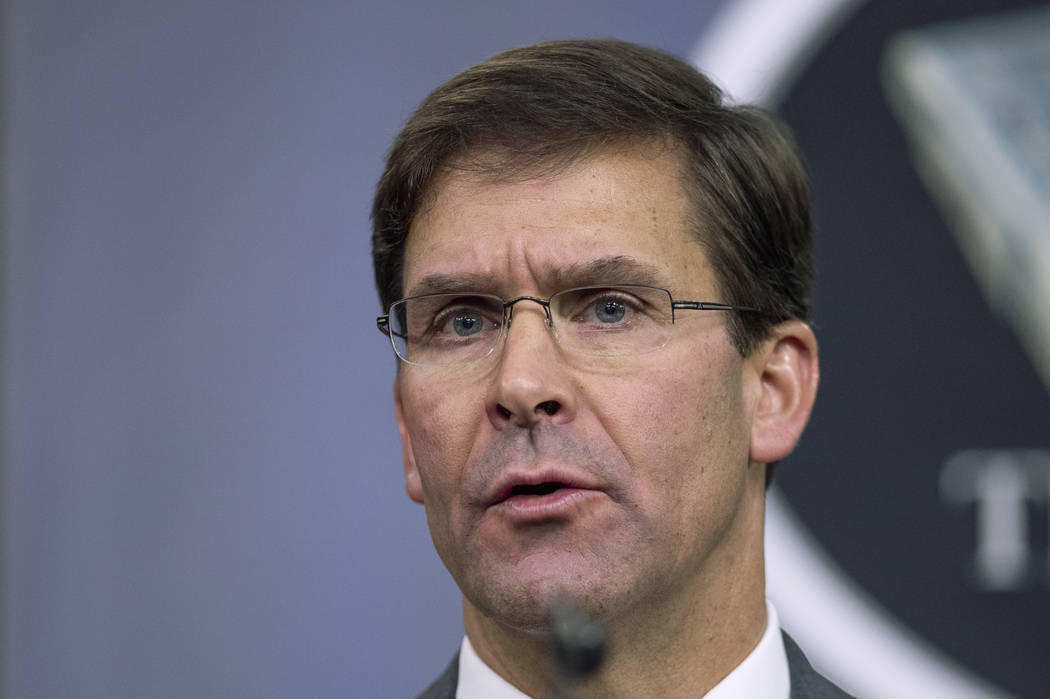 FILE - In this Aug. 28, 2019, file photo, Secretary of Defense Mark Esper speaks to reporters d ...