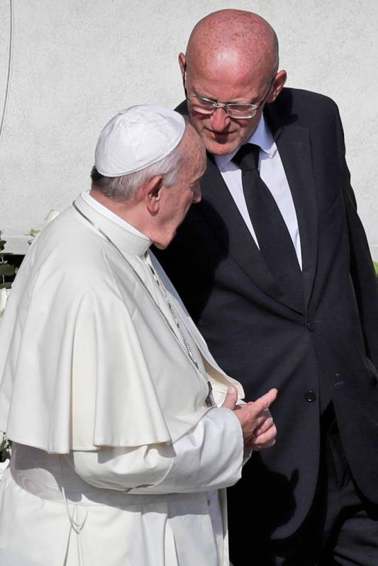 Vatican head of security Domenico Giani, right, shares a word with Pope Francis at the end of a ...