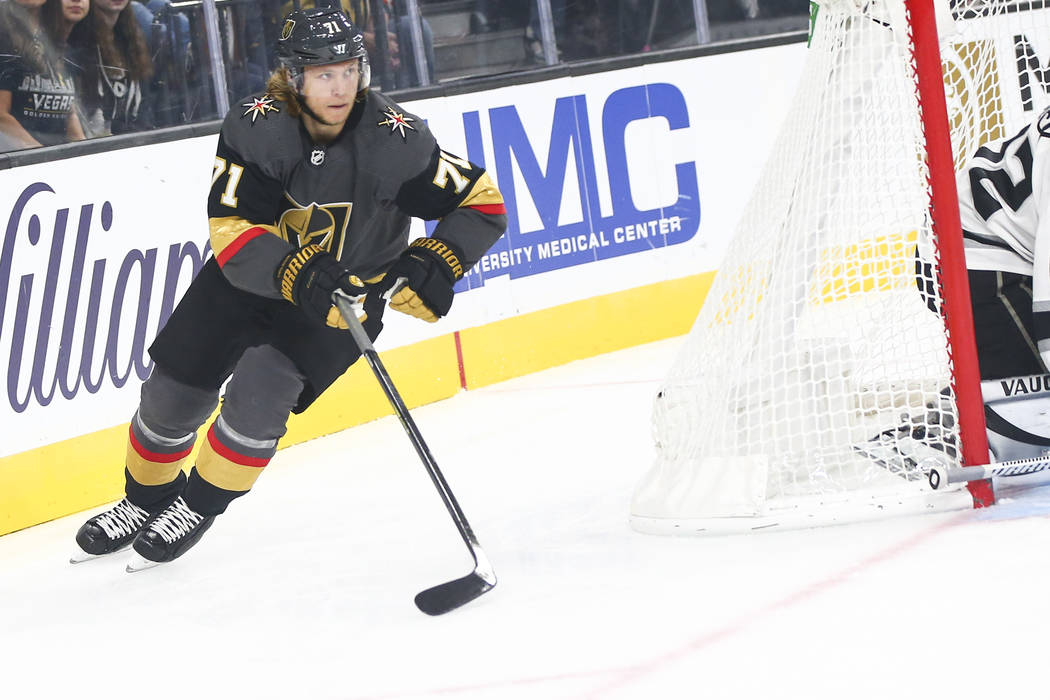 Golden Knights' William Karlsson (71) chases after the puck as Los Angeles Kings goaltender Jon ...