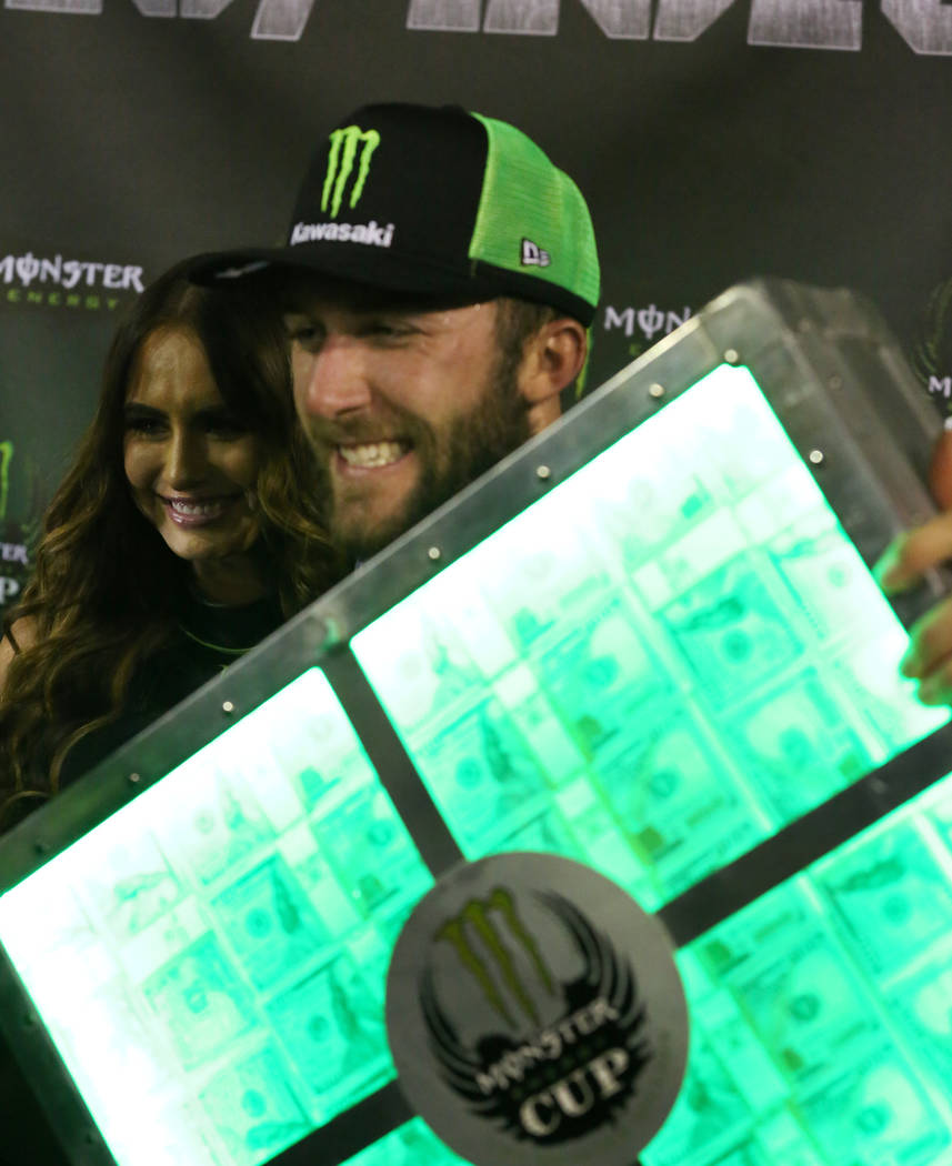 Eli Tomac shows off his one million dollars after winning the 2018 Monster Energy Cup Race at S ...