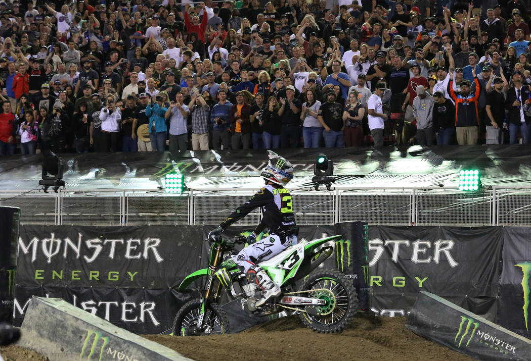 Fans watch as Eli Tomac celebrates his win in the 2018 Monster Energy Cup Race at Sam Boyd Stad ...