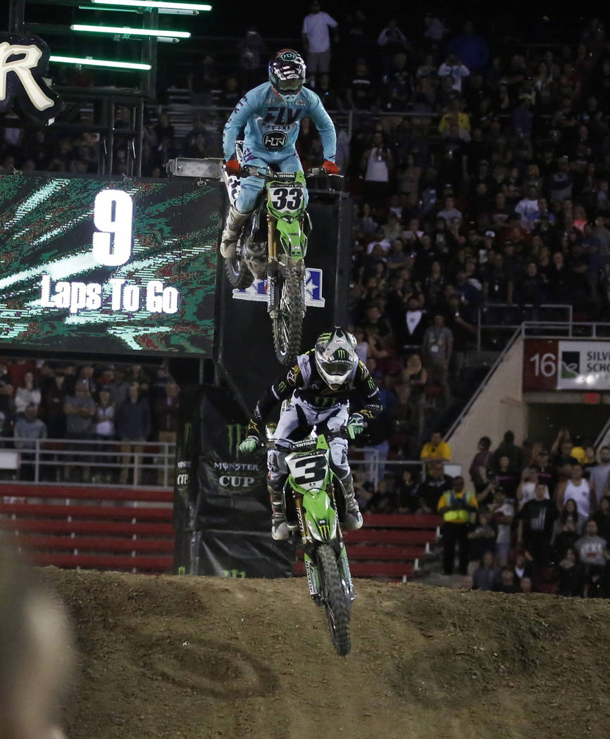 Eli Tomac (3) and Joshua Grant (33) compete during the 2018 Monster Energy Cup Race at Sam Boyd ...