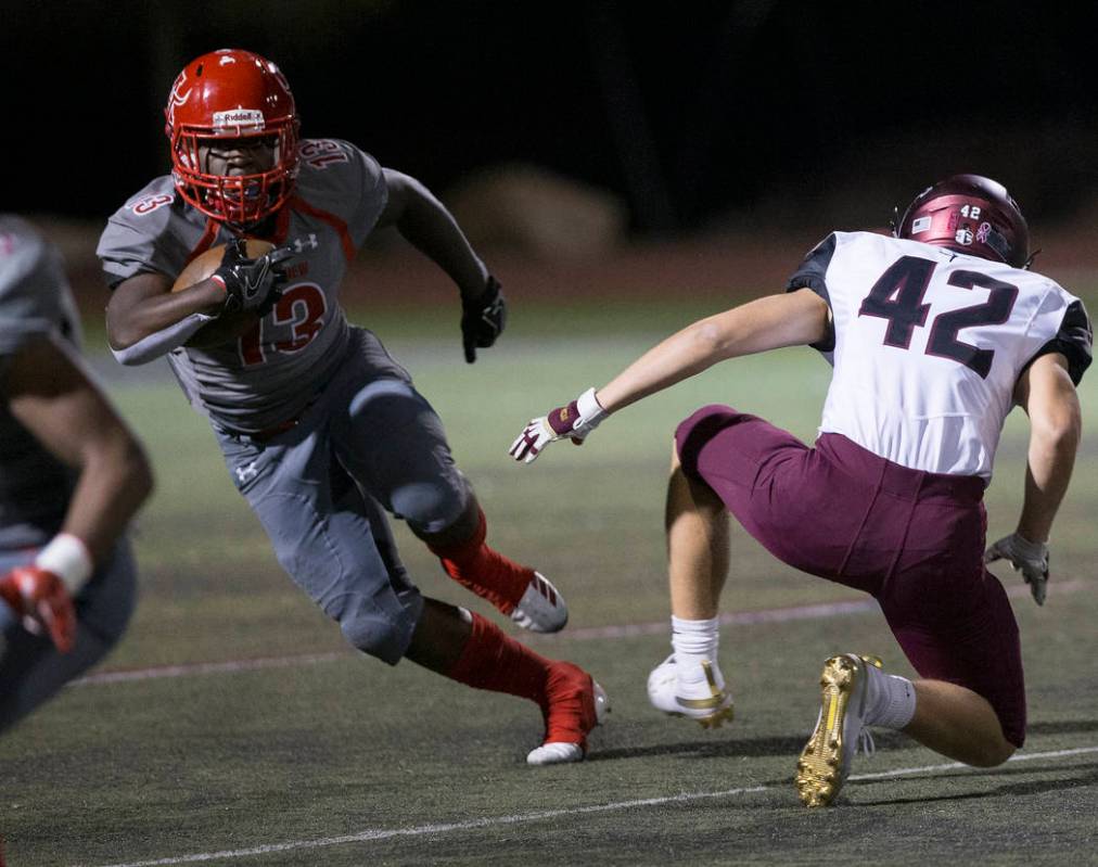 Arbor View sophomore running back D'Andre Washington (13) returns a kick past Faith Lutheran se ...