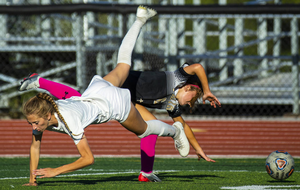 Arbor View's Abby Cassano (6, left) and Faith Lutheran's Camille Longabardi (6) collide over th ...