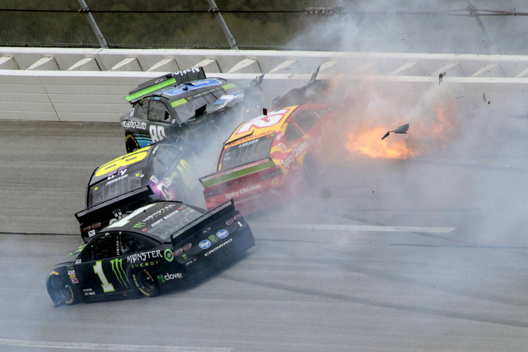 Kurt Busch (1), Jimmie Johnson (48), Alex Bowman (88) and Kyle Larson (42) collide in Turn 3 du ...