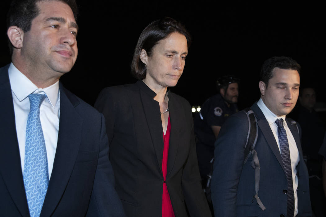 Former White House advisor on Russia, Fiona Hill, center, leaves Capitol Hill in Washington, Mo ...