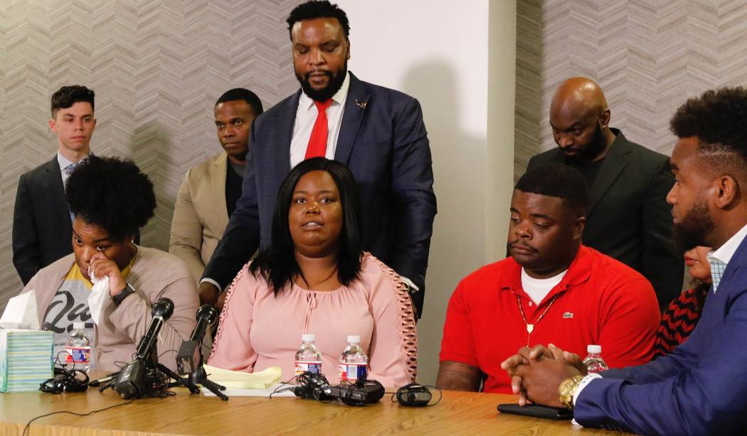 Amber Carr, left, wipes a tear as her sister Ashley Carr, center, talks about their sister, Ata ...