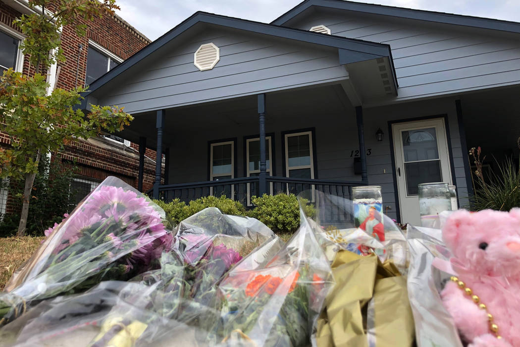 Bouquets of flowers and stuffed animals are piling up outside the Fort Worth home Monday, Oct. ...