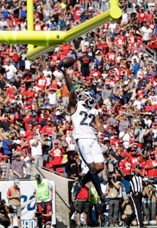 Los Angeles Rams cornerback Marcus Peters (22) jumps after intercepting a pass in the end zone ...