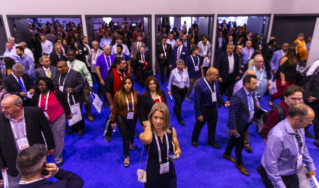 Attendees stream onto the exhibition area floor during the Global Gaming Expo 2019 at the Sands ...