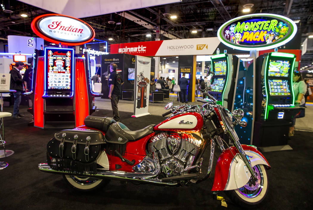 An Indian Motorcycle is on display for the Pervasive Gaming exhibition space featuring the bike ...