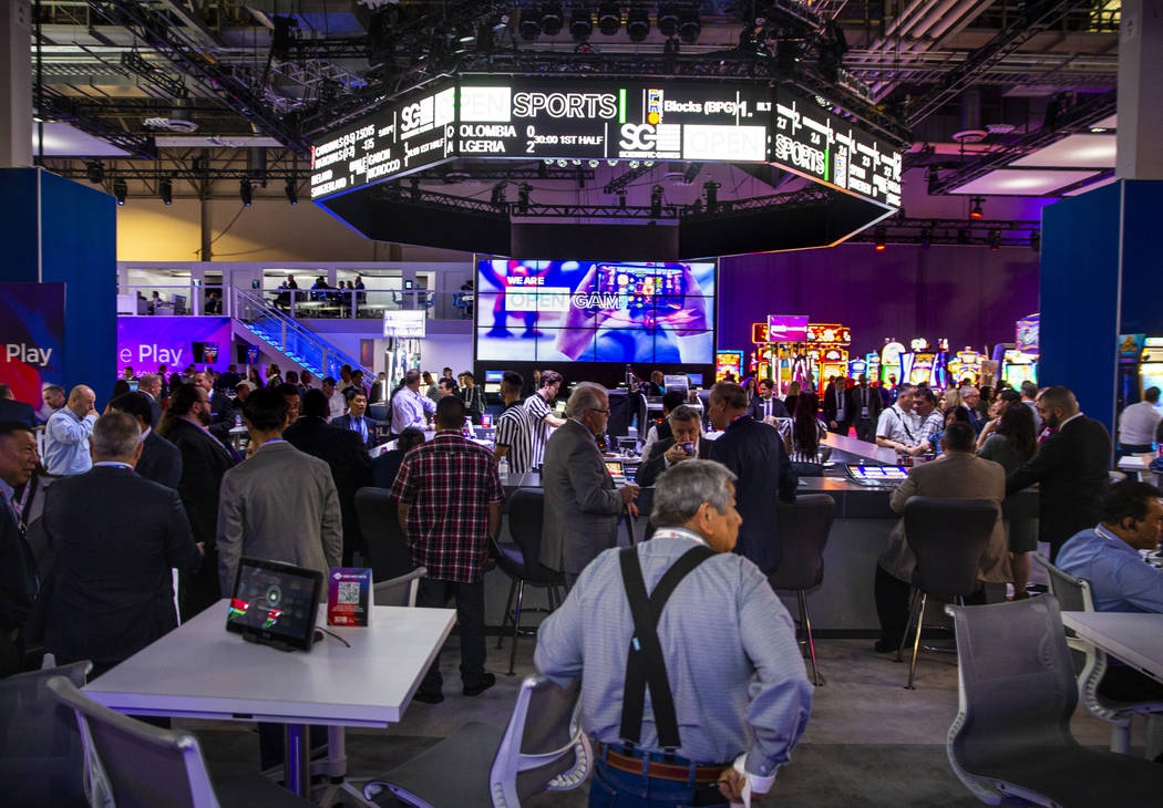 The bar is in full swing within the Scientific Games Corporation exhibition space during the Gl ...