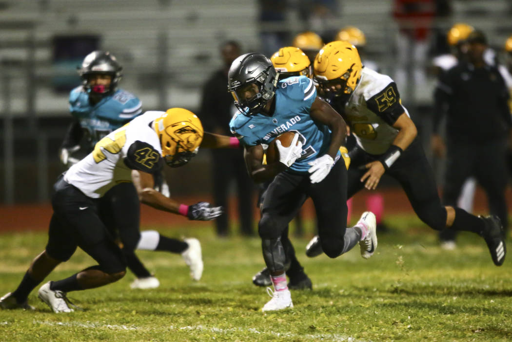 Silverado's Aginae Cunningham (2) runs the ball against Clark during the first half of a footba ...