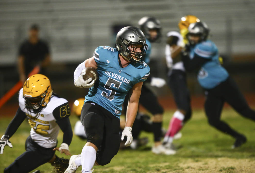 Silverado's Brandon Powers (5) runs the ball against Clark during the first half of a football ...