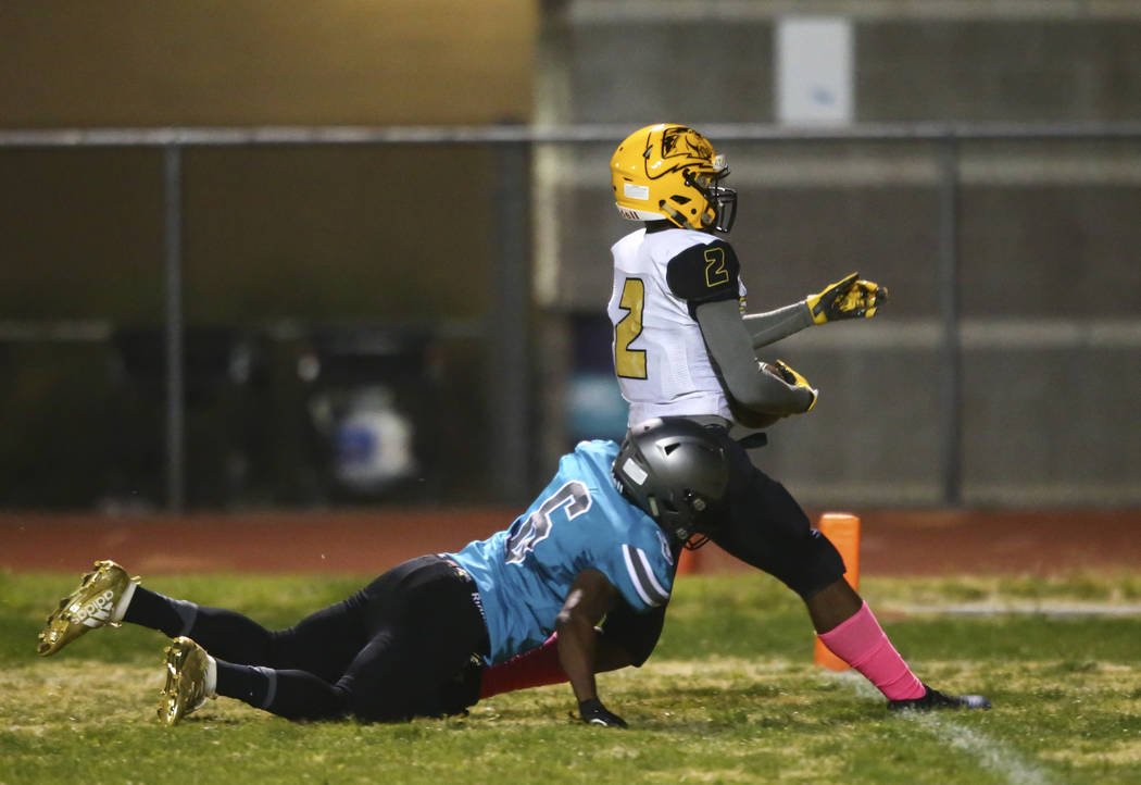 Clark's Kenneth Cason (2) gets to the endzone to score a touchdown as Silverado's John Agounke ...