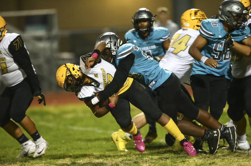 Silverado's Kyrell Mcbride (24) takes down Clark quarterback My'quel Johnson (7) during the sec ...