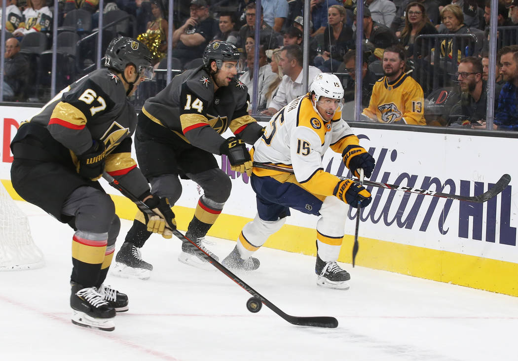 Vegas Golden Knights left wing Max Pacioretty (67) and Golden Knights defenseman Nicolas Hague ...