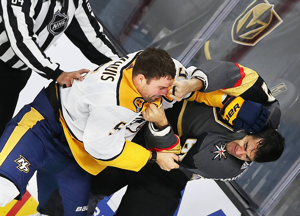 Vegas Golden Knights left wing Max Pacioretty (67) fights Nashville Predators defenseman Dan Ha ...