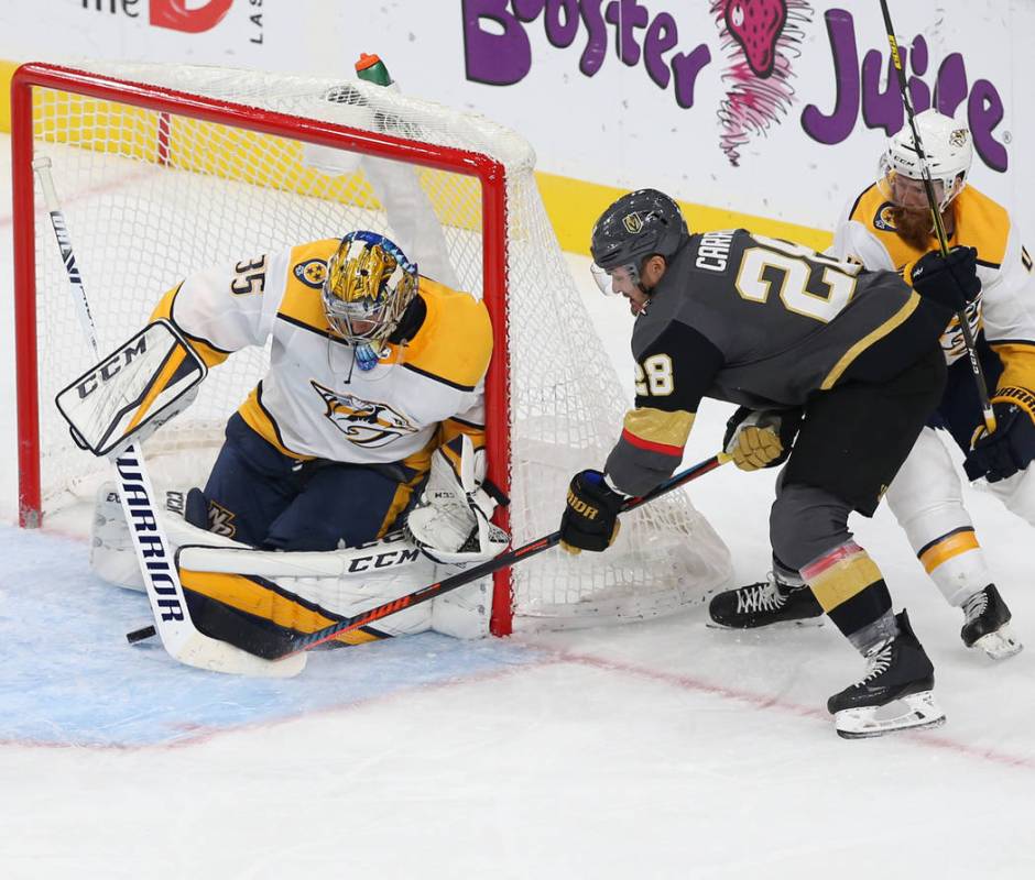 Vegas Golden Knights left wing William Carrier (28) shoots on Nashville Predators goaltender Pe ...