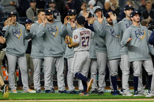Houston Astros second baseman Jose Altuve celebrates with teammates after their 4-1 win against ...