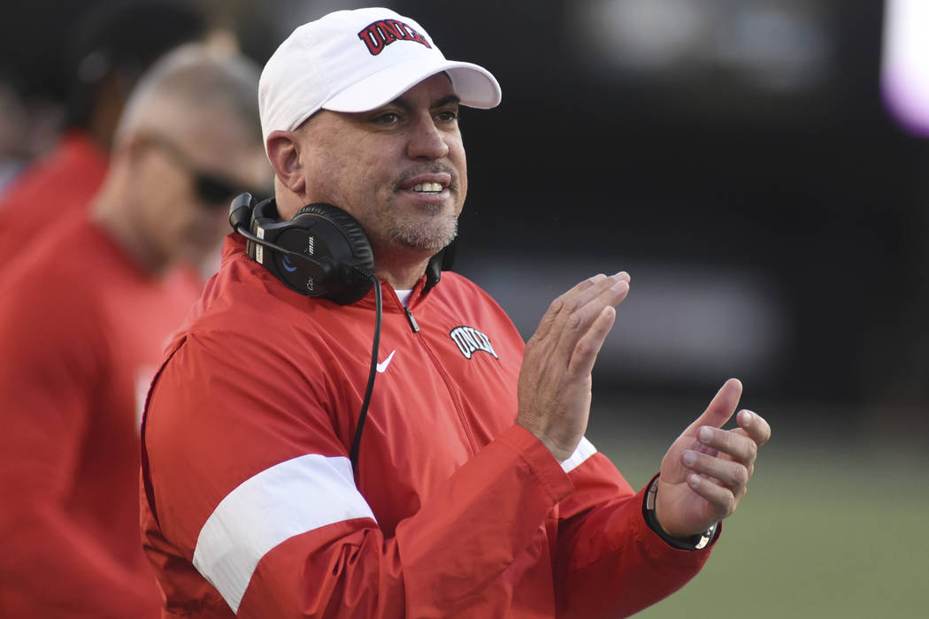 UNLV Head Coach Tony Sanchez encourages his team against Vanderbilt in the second half of an NC ...