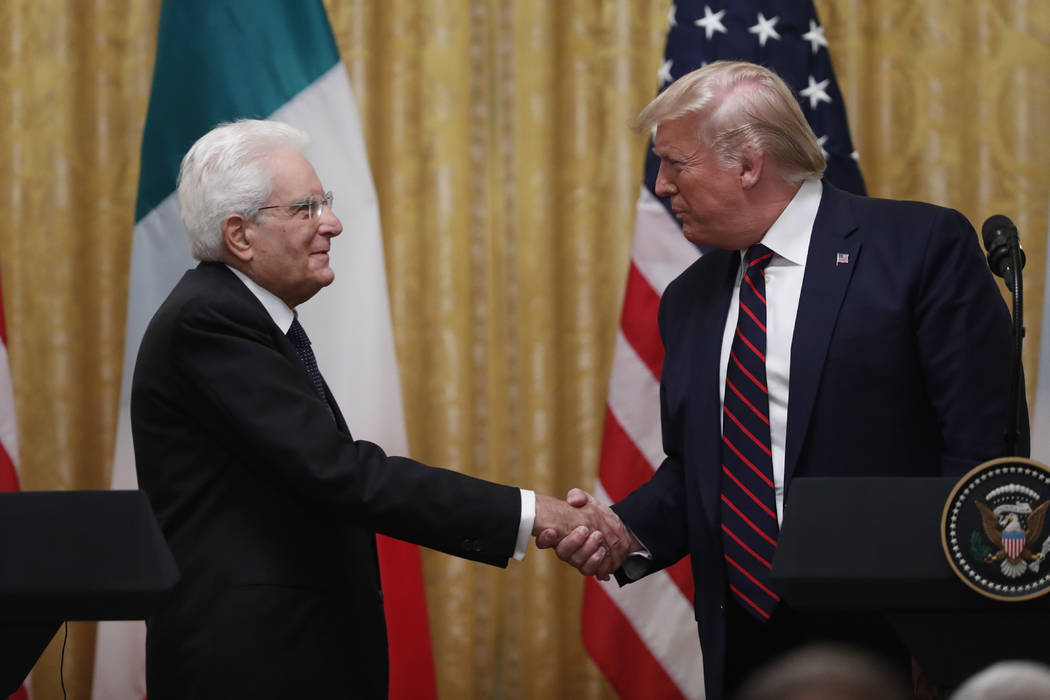 President Donald Trump shakes hands with Italian President Sergio Mattarella during a news conf ...