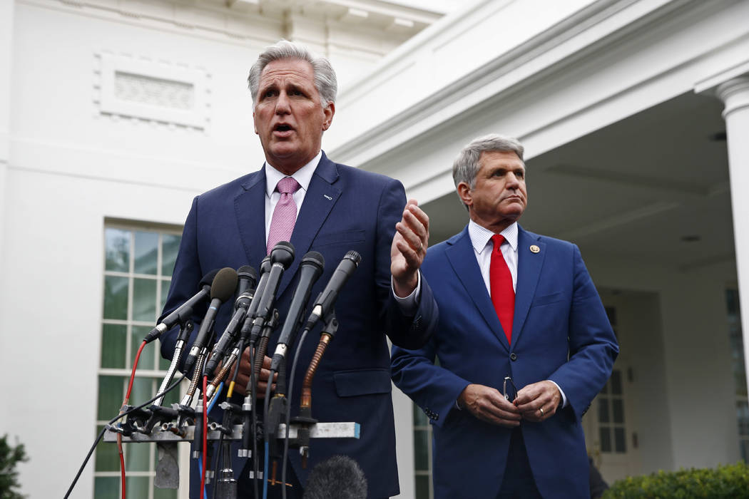 House Minority Leader Kevin McCarthy of Calif., left, speaks with members of the media alongsid ...