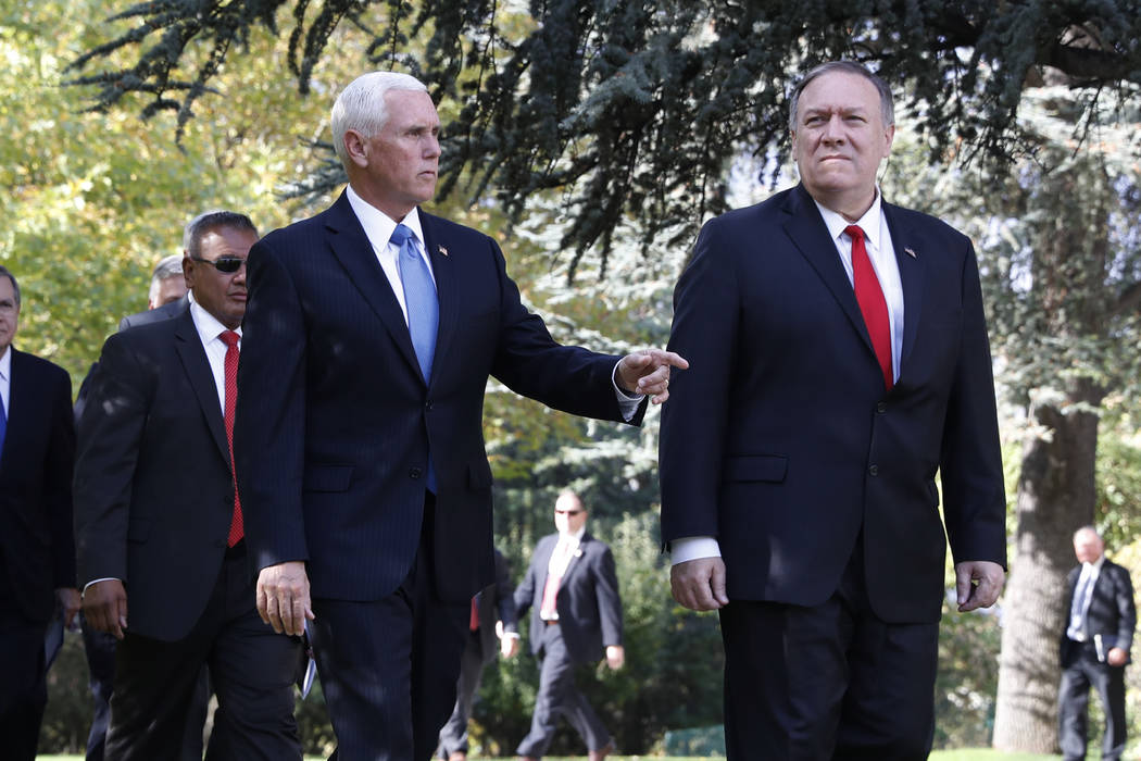 Vice President Mike Pence, left, and Secretary of State Mike Pompeo leave the Ambassador&#x2019 ...