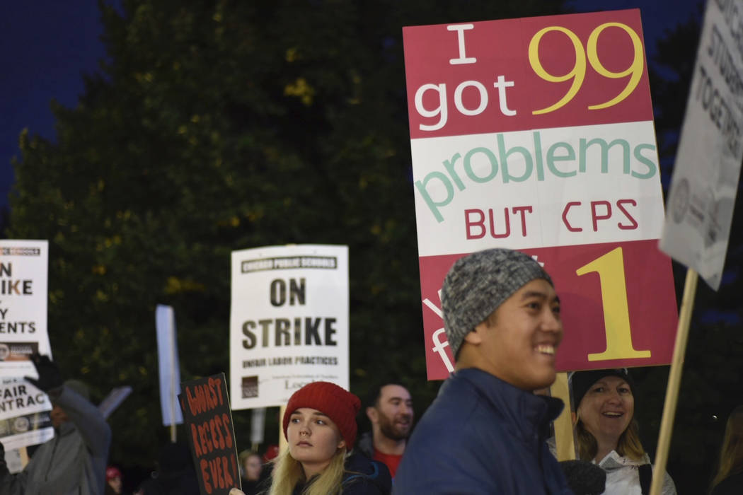 Chicago Public Schools teachers picket early Thursday morning, Oct. 17, 2019, at Lane Tech High ...