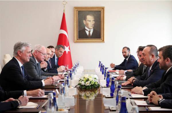 Turkish Foreign Minister Mevlut Cavusoglu, second right, and U.S. National Security Advisor Rob ...
