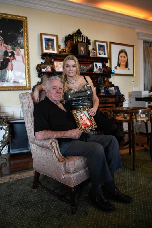 David and Jackie Siegel, hold a photo of their daughter at their home in Windermere, Fla., on O ...